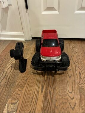 Red Remote Control Monster Truck with Large Off-Road Tires. Eztec
